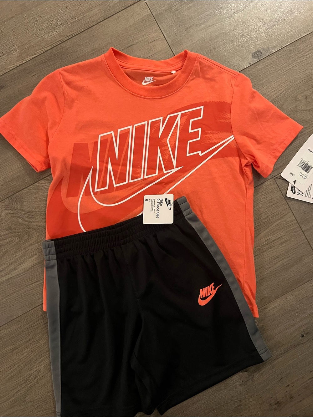Nike Orange Graphic Tee with Black Athletic Shorts